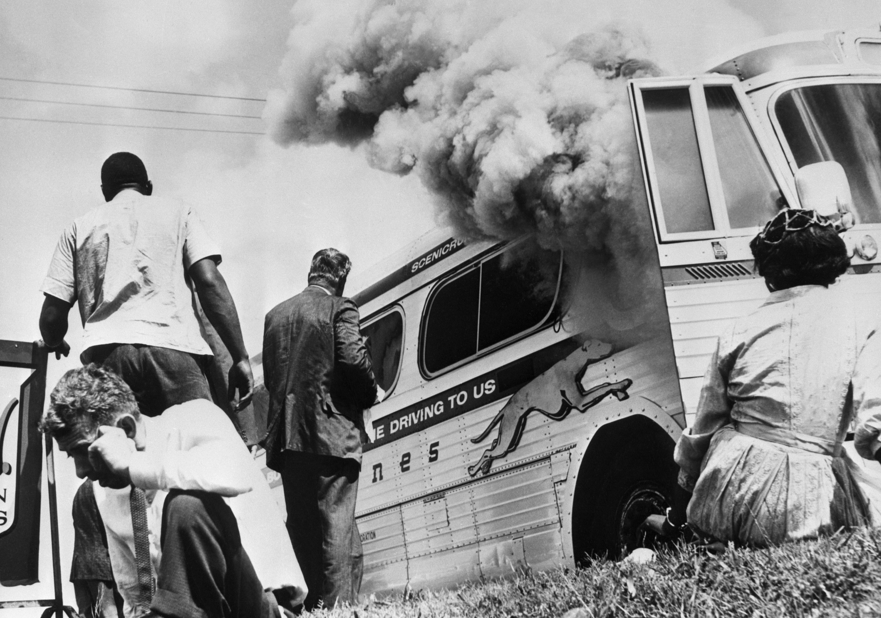 Greyhound bus that had carried FREEDOM RIDERS burns beside the ...
